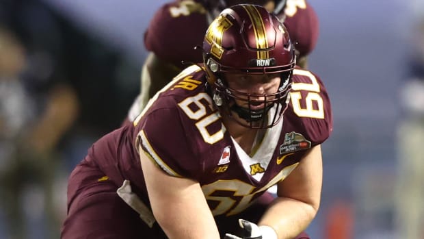 Minnesota Golden Gophers center John Michael Schmitz (60) against the West Virginia Mountaineers in the Guaranteed Rate Bowl at Chase Field.
